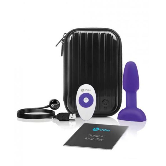 black hard body with zipper all the way around storage case, purple petite plug, white remote with purple accents, black USB charging cord, black with teal b-vibe logo guide to anal play manual