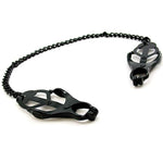 black coated metal chain connecting leaf shaped and cut out nipple clamps on each end