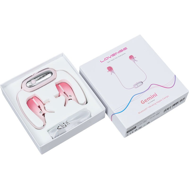 packaged in white box with pink details lovense Gemini app controlled connected by white cord pink and white ombre nipple clamps