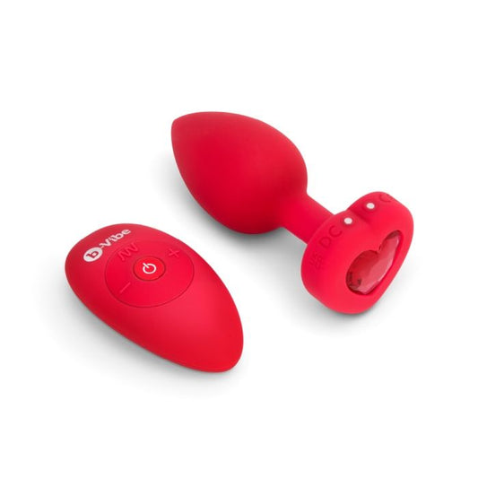 red b-vibe butt plug with heart shaped base and inset red gem and red remote