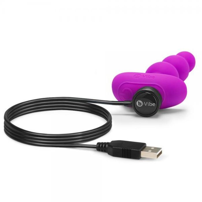 magenta anal beads style plug with large tapered end and magnetic USB charging cord attached.