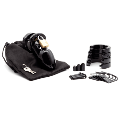 Fully assembled black CB-3000 chastity cage sitting on black cotton storage pouch with 2 metal keys to left. 3 black locking pins, 3 black spacers, 4 stacked black U-rings and 5 black plastic locks lay displayed to the right.