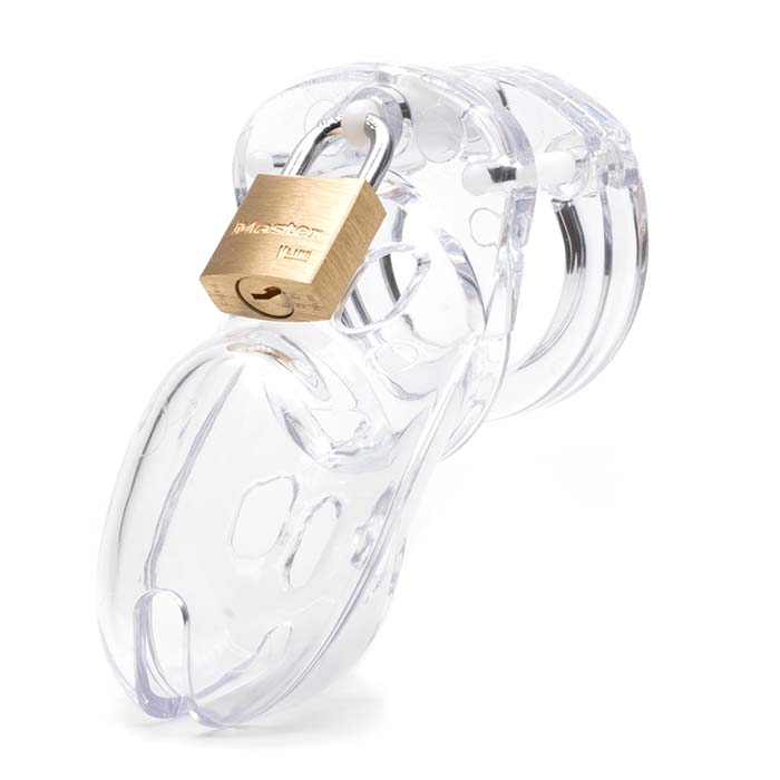 Front view, with tip angled to the left of a fully-assembled clear CB-3000 penis chastity cage locked together with a brass Master padlock. Three white locking pins connect the base ring to the penis cage.