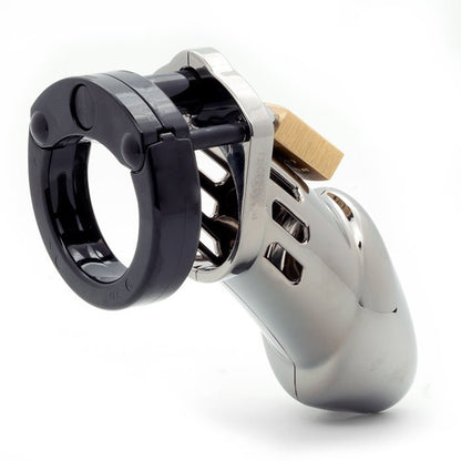 Back and side view, with tip angled to the right of a fully-assembled chrome finish and black CB-6000 penis chastity cage. Brass lock can be seeing hanging from center locking pin.
