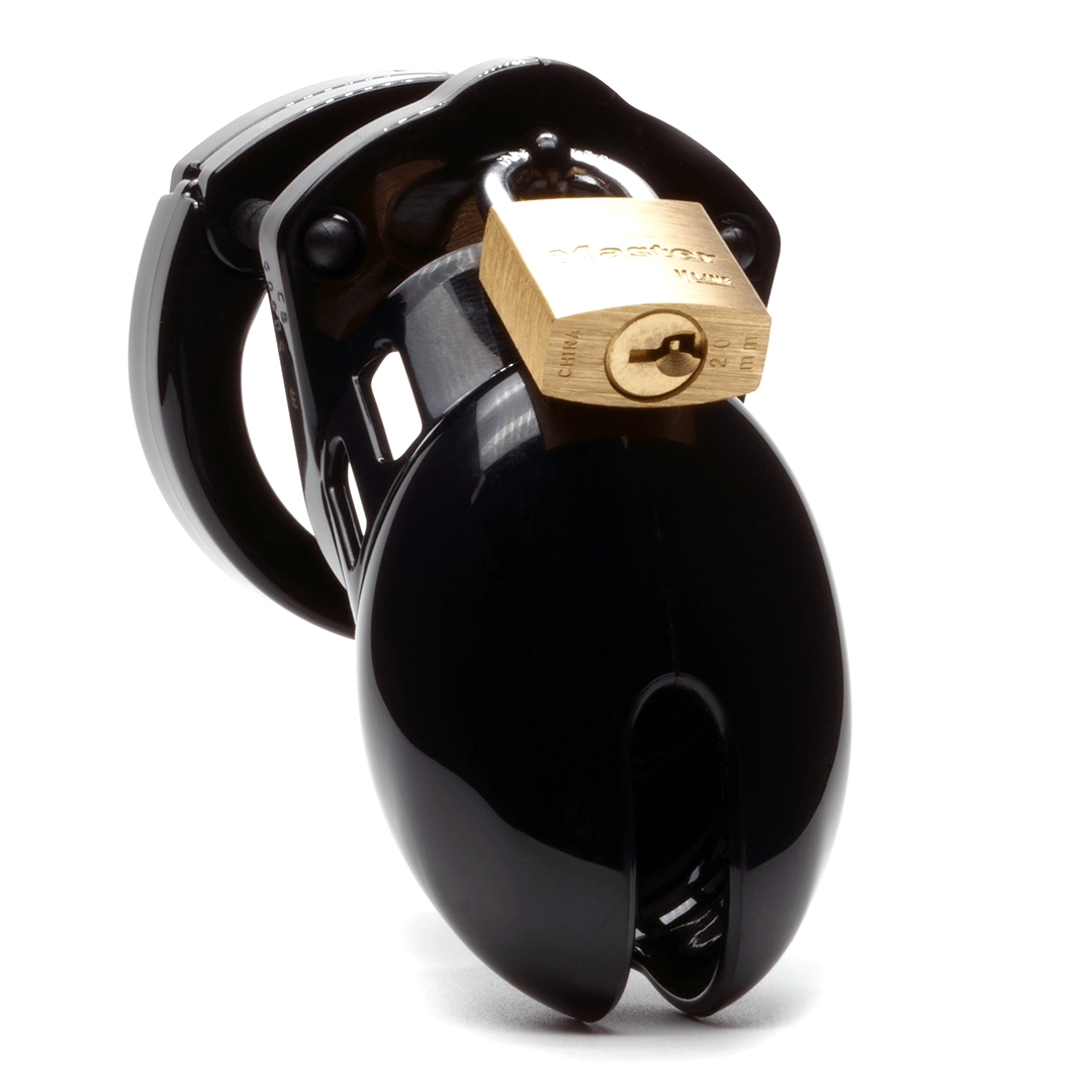 Front view, with tip angled to the right of a fully-assembled black CB-6000s penis chastity cage. Three black locking pins connect the base ring to the penis cage and a brass padlock is secured through the hole on the center locking pin.