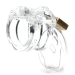 Back and side view, with tip angled to the left of a fully-assembled clear CB-6000s penis chastity cage. Three white locking pins connect the base ring to the penis cage and a brass padlock is seen hanging from the center locking pin.