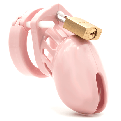 Front view, with tip angled to the right of a fully-assembled pale bubblegum pink CB-6000s penis chastity cage. Three white locking pins connect the base ring to the penis cage and a brass padlock is secured through the hole on the center locking pin.