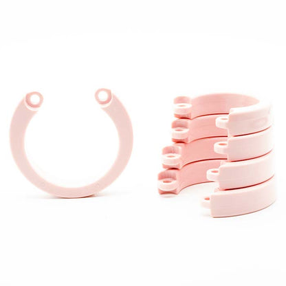 single pink CB-X Replacement U-ring next to stack of four pink u-rings