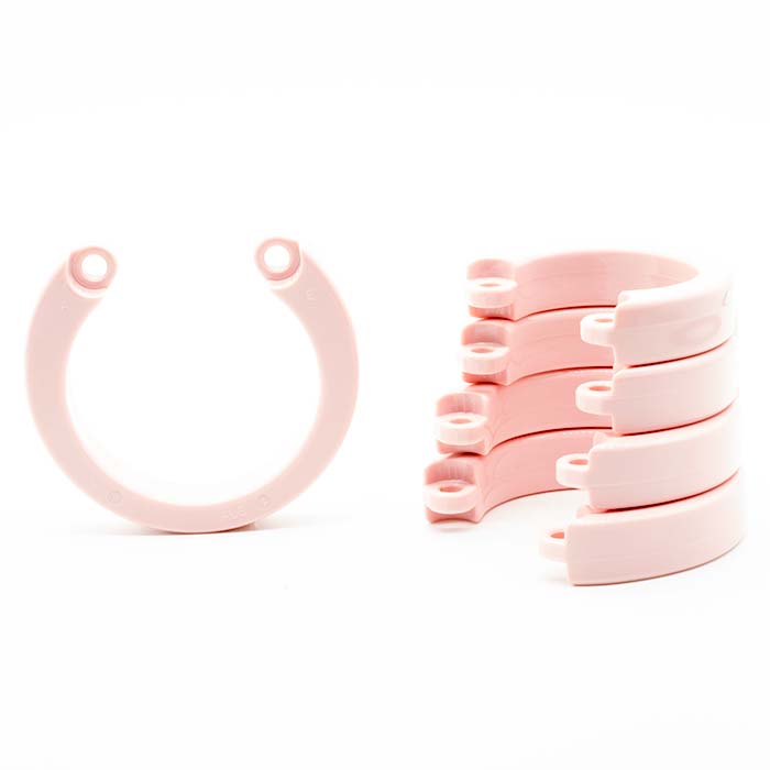 single pink u-ring next to stack of four pink u-rings