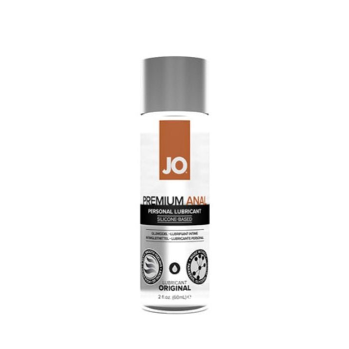 Front of System JO® Premium Anal Silicone-based lubricant 2 ounce bottle. Bottle is clear with black and brown accents with a silver cap.