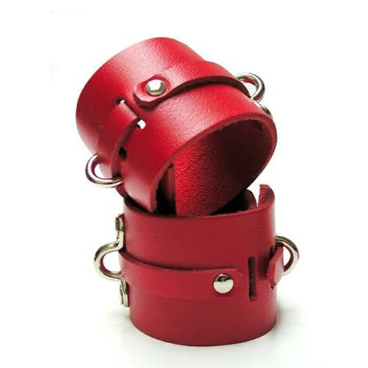 red leather wrist cuffs, with metal details and d-rings stacked