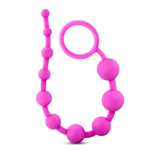 looped in u-shape, pink string of Silicone Anal Beads with 10 beads starting from smallest to largest and increasing in size up to the removal ring