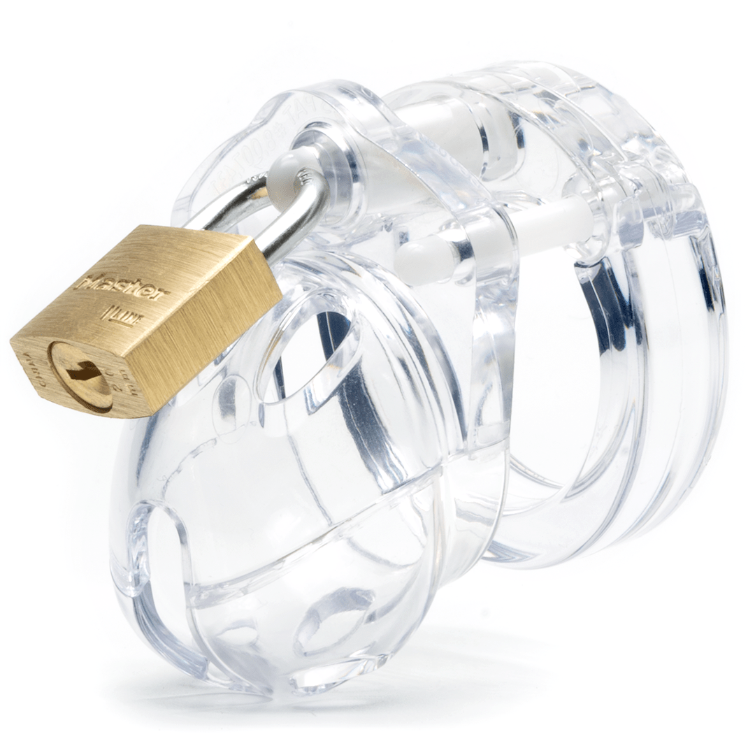 Front and side view, with tip angled to the left of a fully-assembled clear Mini-Me penis chastity cage. Three white locking pins connect the base ring to the penis cage and a brass padlock is secured through the hole on the center locking pin.