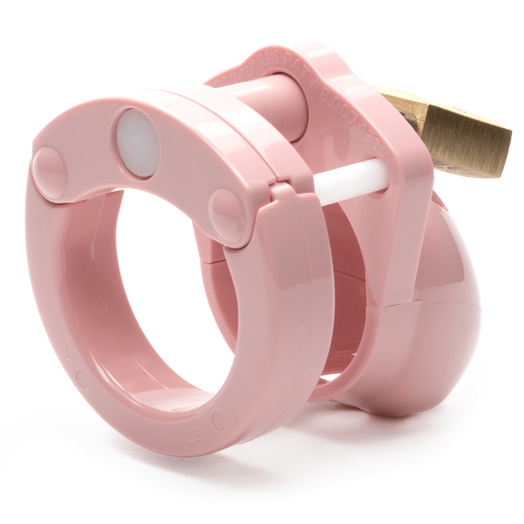 Back view, with tip angled to the right of a fully-assembled pale bubblegum pink Mini-Me penis chastity cage. Three white locking pins connect the base ring to the penis cage. A brass padlock is seen hanging on the front through the hole on the center locking pin.
