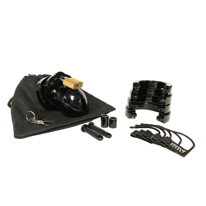Fully-assembled black Mr. Stubb chastity cage on black storage pouch with 2 metal keys to left. 2 black spacers, 2 black locking pins, 4 black stacked U-rings and 5 black plastic locks sit displayed on right.
