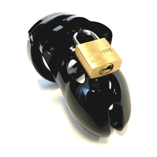 Front view, with tip angled to the right of a fully-assembled black Mr. Stubb penis chastity cage. Three black locking pins connect the base ring to the penis cage and a brass padlock is secured through a hole on the center locking pin.