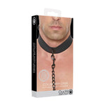 packaged black puppy play neoprene collar with leash shown on male neck