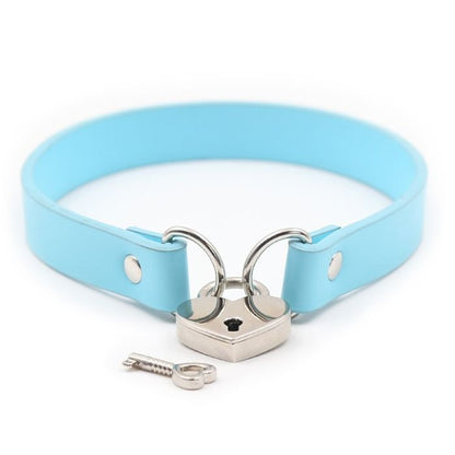 light blue pvc collar with metal loops on each end, linked together with a silver heart padlock, one key lying next to the lock