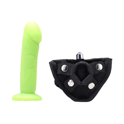 electric green Tantus Vamp dildo and black with silver detail Strap On Harness Kit with bullet vibrator inserted in front pocket of harness and black o-ring.