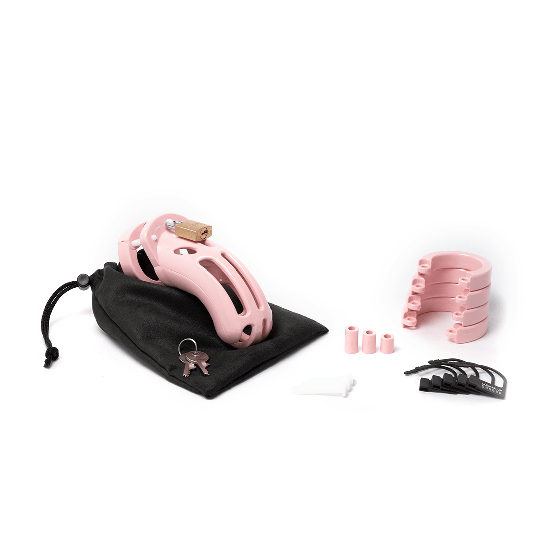 all parts laid of out of the CB-X curve pink chastity kit
